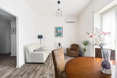 a living room with a table and a couch at La Dimora Arimondi in Rome