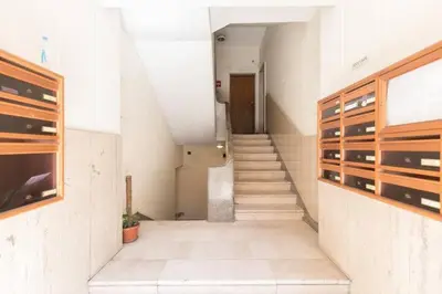 a hallway with stairs in a building with a stair case at La Dimora Arimondi in Rome