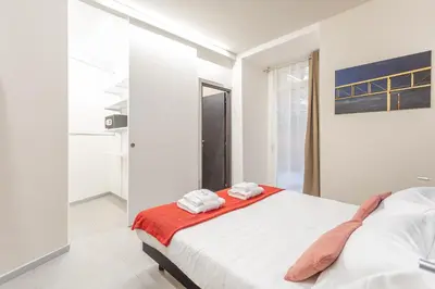 a bedroom with a bed with towels on it at Vatican Museums Stay with Terrace in Rome