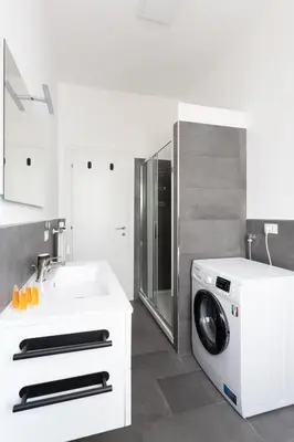 a kitchen with a washing machine and a sink at Macedonia 30 Bright Flat in Rome