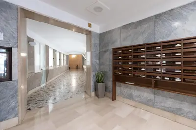 a large room with a wall of wine bottles at Macedonia 30 Bright Flat in Rome