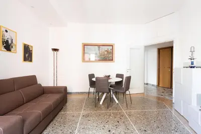 a living room with a couch and a table at Macedonia 30 Bright Flat in Rome