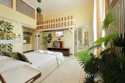 a bedroom with a bed and a tv in it at 4BNB - Victoria Palace in Rome