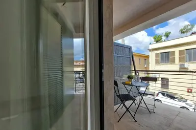 a view of a balcony with a table and a car at Sabelli 1 Villa Indipendente nel Cuore di Roma in Rome