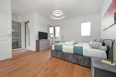 a bedroom with a large bed and a television at Sabelli 1 Villa Indipendente nel Cuore di Roma in Rome