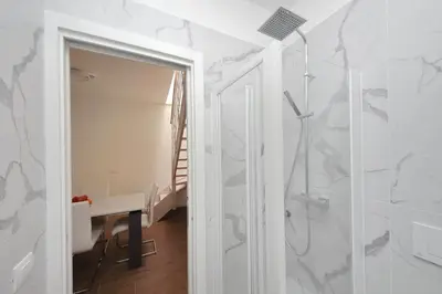 a bathroom with a shower and a walk in shower at Sabelli 1 Villa Indipendente nel Cuore di Roma in Rome