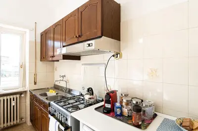 a kitchen with a sink and a stove top oven at Happio Apartment in Rome in Rome