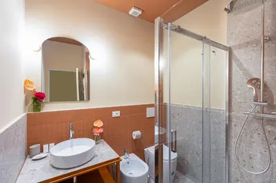 a bathroom with a sink and a shower at Amazing 3 Bedrooms Prati Vatican in Rome