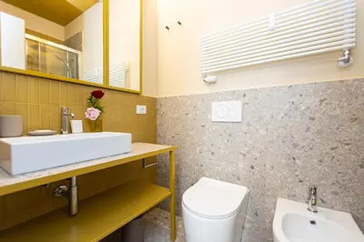 a bathroom with a sink and a toilet at Amazing 3 Bedrooms Prati Vatican in Rome