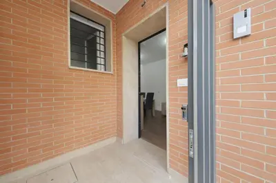 an entrance to a brick wall with a door at Sabelli 2 Villa Indipendente nel Cuore di Roma in Rome