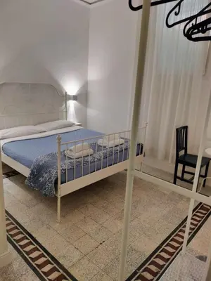 a bedroom with a bunk bed and a chair at Vatican Room- all you need to sleep 3 in Rome