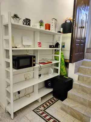 a hallway with white walls and a white door at Vatican Room- all you need to sleep 3 in Rome