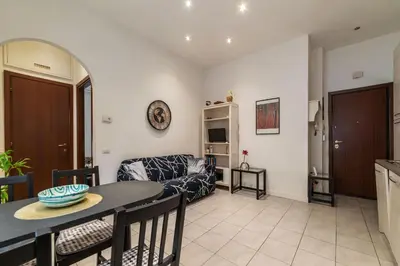 a living room with a couch and a table at GuestHost - Comfy Apartment X2 in Monteverde in Rome