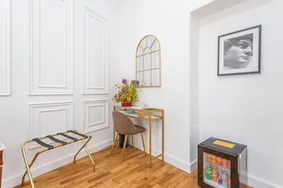 a living room with a table and a chair at Blue Prestige Suites in Rome
