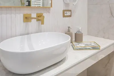 a bathroom with a large white tub on a counter at Blue Prestige Suites in Rome