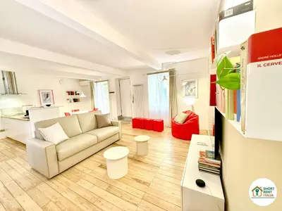 a living room with a couch and a table at Colosseo - Venus House in Rome