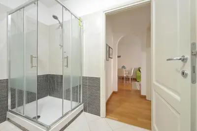 a shower with a glass door in a bathroom at 4BNB - Porta Portese Cozy Apartment in Rome