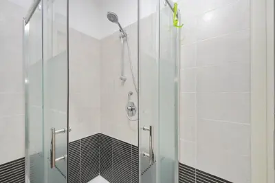 a shower with a glass door in a bathroom at 4BNB - Porta Portese Cozy Apartment in Rome