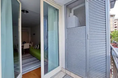 a sliding glass door leading to a balcony at 4BNB - Porta Portese Cozy Apartment in Rome