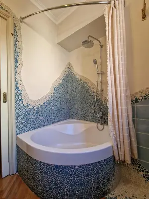 a blue and white bath tub in a bathroom at Luxury Suite Dante Elegante Appartamento di Lusso nel Cuore di Roma in Rome
