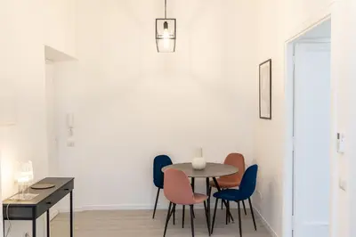 a dining room with a table and chairs at Constance Terrace Apartment by Rental in Rome in Rome
