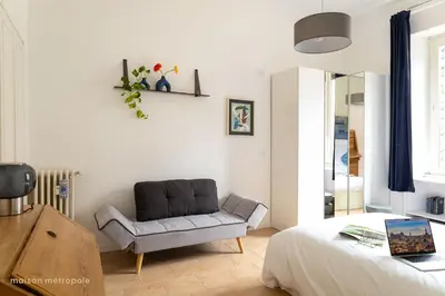 a living room with a couch and a chair at Trastevere Art House & terrace in Rome