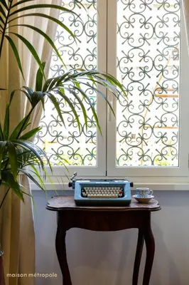 a keyboard on a table in front of a window at Trastevere Art House & terrace in Rome