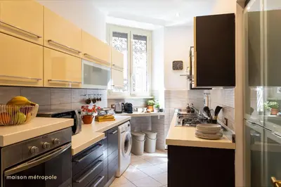 a kitchen with a stove and a sink at Trastevere Art House & terrace in Rome