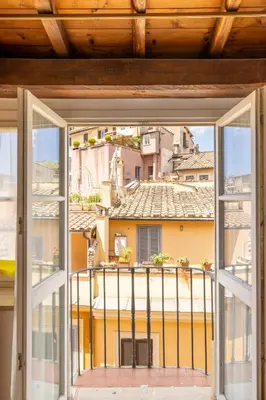 an open window with a view of a city at Piazza Navona Rooftop Retreat S in Rome