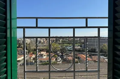 a window with a view of a city at Nomentana Home in Rome