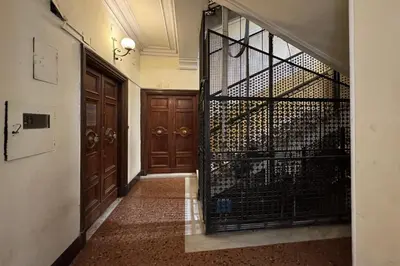 a hallway with a door to a wine cellar at Nomentana Home in Rome