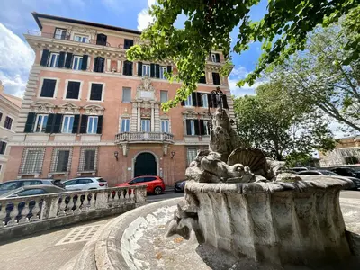 a statue of a lion in front of a building at Appartamento Porto di Ripetta in Rome