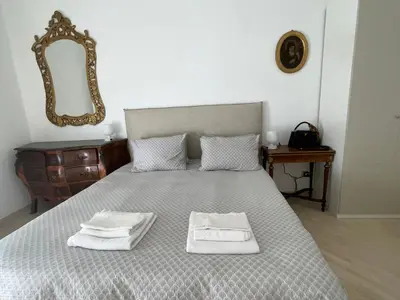 a bedroom with a bed with two towels on it at Appartamento Porto di Ripetta in Rome