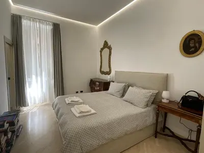 a bedroom with a bed with a tray on it at Appartamento Porto di Ripetta in Rome