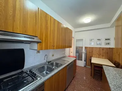 a kitchen with a sink and a stove top oven at Rome in Retro Style in Rome