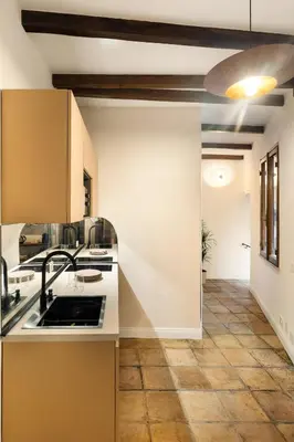 a kitchen with a sink and a counter top at the secret terrace - navona in Rome