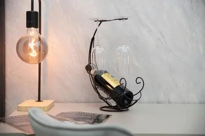 a desk with a lamp and a phone on it at Olimpico Luxury Rooms in Rome