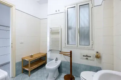 a bathroom with a toilet and a sink at Atelier Latino in Rome