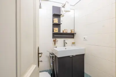 a bathroom with a sink and a mirror at Atelier Latino in Rome