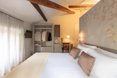 a bedroom with a large white bed with two pillows at Decòncept House in Rome