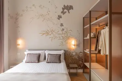a bedroom with a bed and a wall mural at Decòncept House in Rome