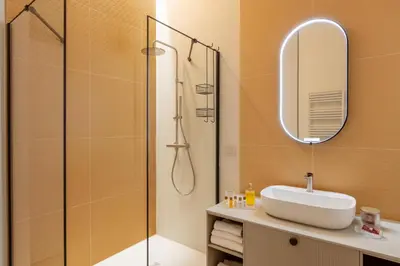 a bathroom with a sink and a shower at Decòncept House in Rome