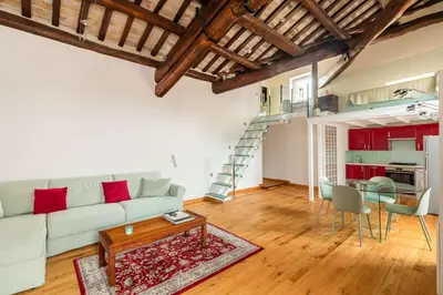 a living room with a couch and a table at Pantheon Palace Loft by RomeLoft in Rome
