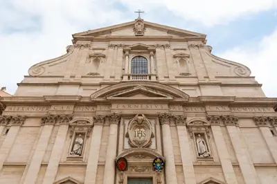 a tall building with a cross on top of it at Pantheon Palace Loft by RomeLoft in Rome