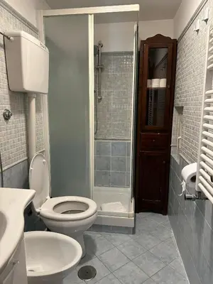 a bathroom with a toilet and a sink and a shower at Karina Suite in Rome