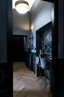 a hallway with a table and chairs in a room at One of one Experiences - CINEMA ROOM in Rome