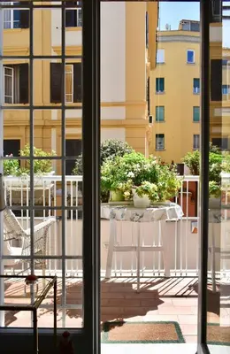 a view from a window of a table with plants on it at Home in Parioli in Rome