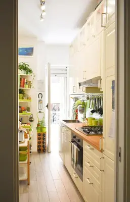 a kitchen with white cabinets and a stove at Home in Parioli in Rome
