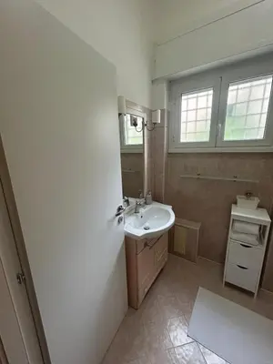 a bathroom with a sink and a mirror at Casa Garbata in Rome