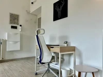 a desk and a chair in a room at Aurum Homes - Vaticano Lux Appartament in Rome